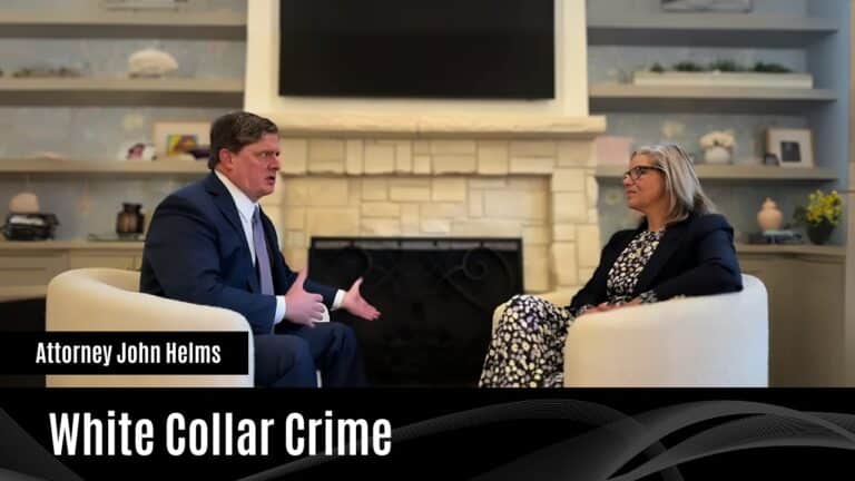 Attorney John Helms discusses white collar crime with a woman.